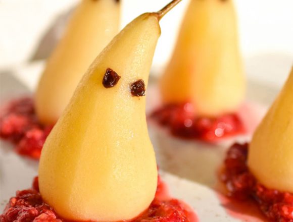Spooky poached pears with a raspberry base