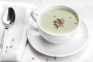 Cream of Celery Soup with Pumpkin Seeds in Soup Cup
