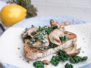 Creamy garlic mixed mushrooms with grated lemon and thyme on sourdough toast