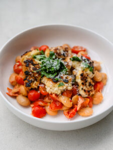 Crispy Panko Chicken with Mascarpone Tomato Butter Bean Medley & Garlic Butter Drizzle