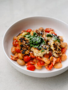 Crispy Panko Chicken with Mascarpone Tomato Butter Bean Medley & Garlic Butter Drizzle