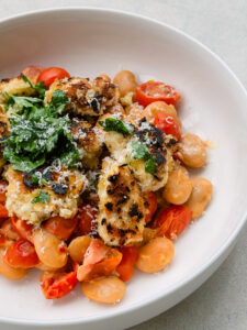 Crispy Panko Chicken with Mascarpone Tomato Butter Bean Medley & Garlic Butter Drizzle
